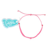 bright pink string knot anklet with Nica Life branded foot shaped tag shown on white