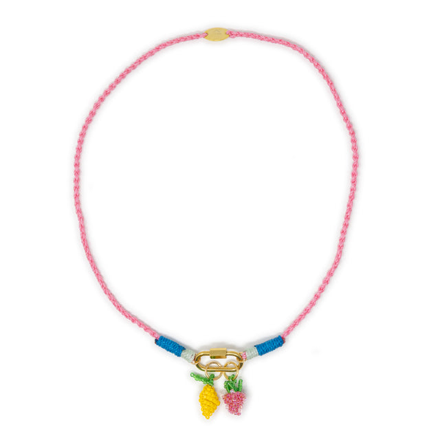 Pink hand braided rope charm necklace with lemon & strawberry beaded charms shown on white