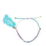 Pink & teal waterproof string knot anklet shown with Nica Life branded foot shaped tag on white