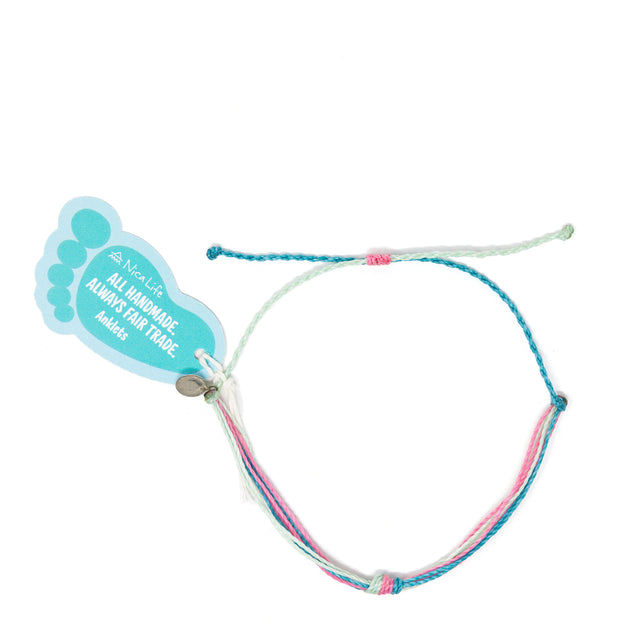 Pink & teal waterproof string knot anklet shown with Nica Life branded foot shaped tag on white