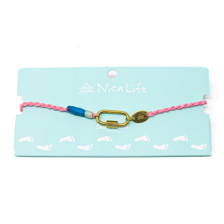 Anklet with pink and blue hand braided cord with a gold carabiner for charms on a Nica Life branded card