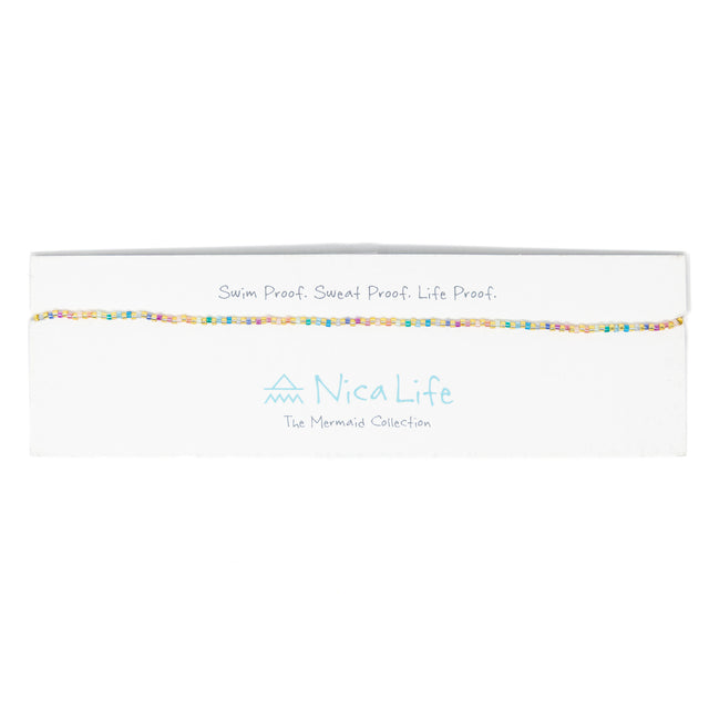 Pastel rainbow color seed bead choker on Nica Life brande card