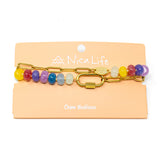 Colorful stone charm necklace on a Nica Life branded card