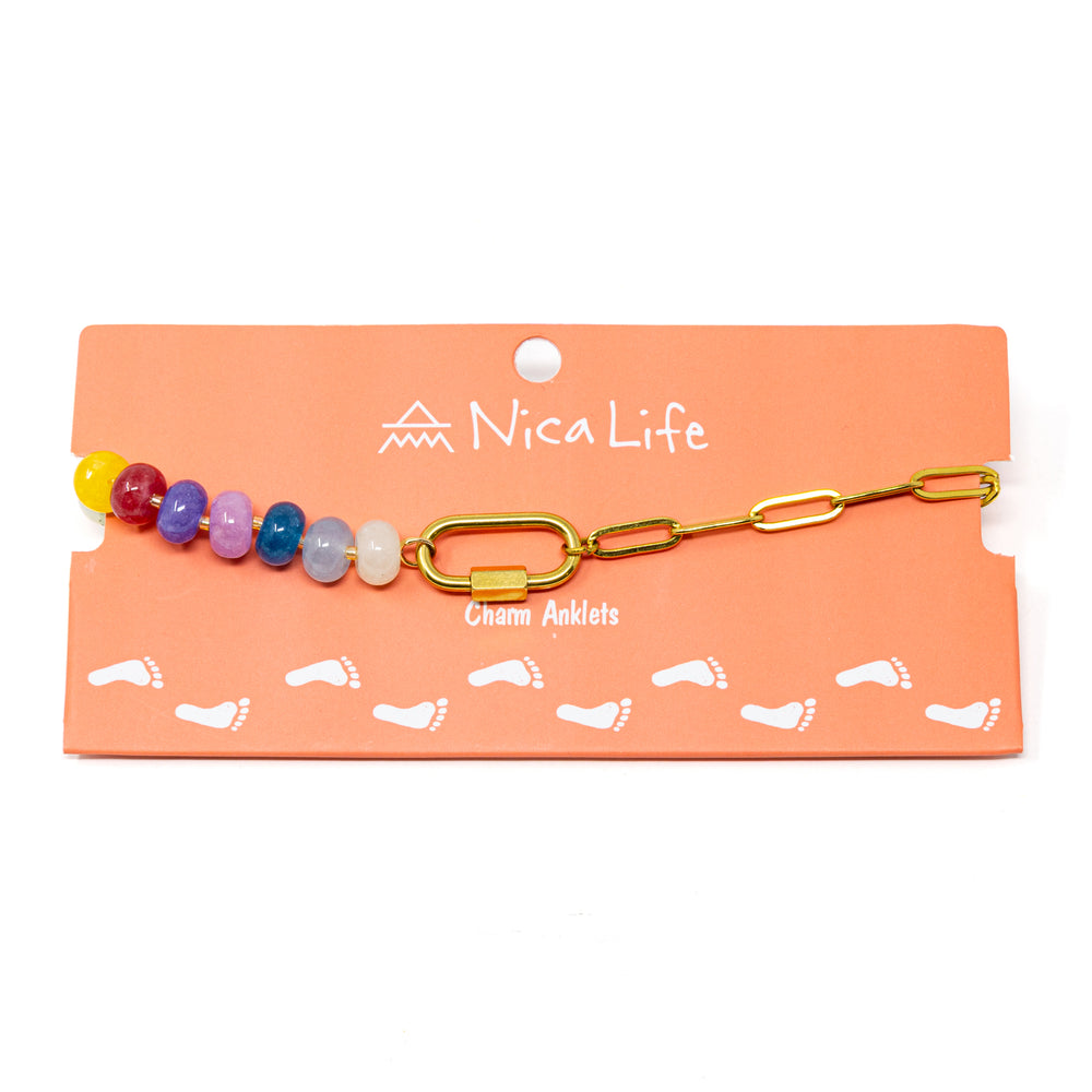 Charm anklet on Nica Life branded packaging with colorful beads and gold chain and a carabiner clasps to hold charms