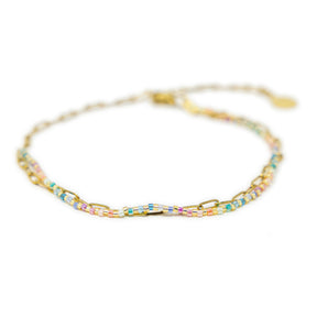 Pastel rainbow beaded anklet with gold chain shown on white from front