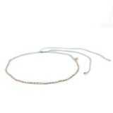 Beaded waterproof choker in pastel rainbow colors on a white background
