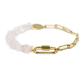 Gold chain bracelet with rose quartz beads and a god carabiner for charms on a white background