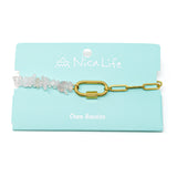 Charm bracelet with rose quartz beads and gold chain on a Nica Life branded card