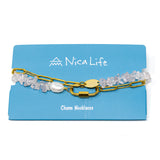 Charm necklace with rose quartz stones and gold chain on a blue card with 'Nica Life' branding