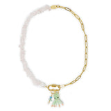 Rose quartz and pearl charm necklace with octopus and stone charms on gold carabiner clasp shown on white