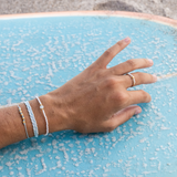 Sea Glass White & Baby Blue Bracelet Stack on Model with Surf Board