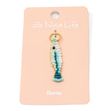 Seafoam multicolored hand beaded fish charm for charm necklace or bracelet on pink Nica Life branded card