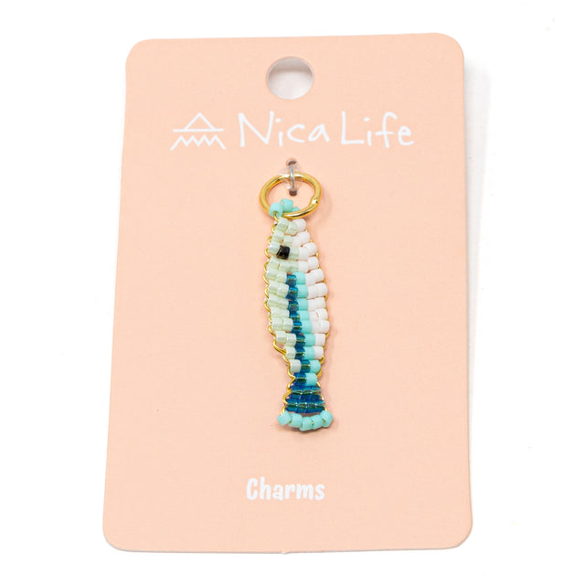 Seafoam multicolored hand beaded fish charm for charm necklace or bracelet on pink Nica Life branded card