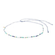 Beaded navy teal gold waterproof choker necklace for surfers on white
