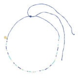 Teal navy and gold beaded surfer girl waterproof choker necklace on white with adjustable cord clasp