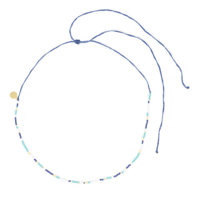 Teal navy and gold beaded surfer girl waterproof choker necklace on white with adjustable cord clasp