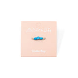 Turquoise & silver handmade ring show on pink Nica Life branded card
