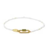 White & gold beaded charm bar anklet with carabiner clasp for charms shown on white front view