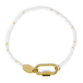 White bead charm bar bracelet with gold chain carabiner for charms on a white background