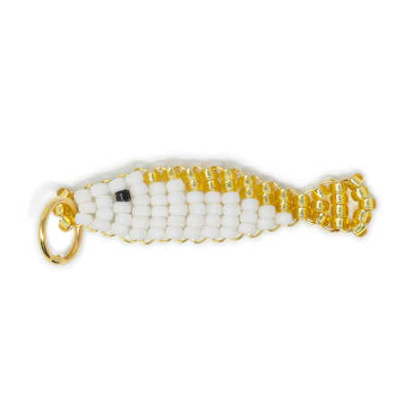 Beaded white & fish charm for charm bracelet or necklace with gold accents on a white background