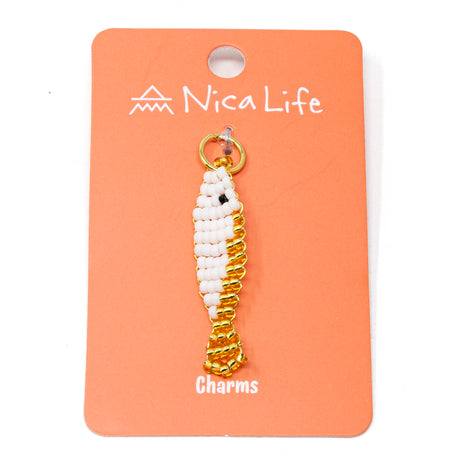 Gold and white beaded charm on a coral card with 'Nica Life' branding