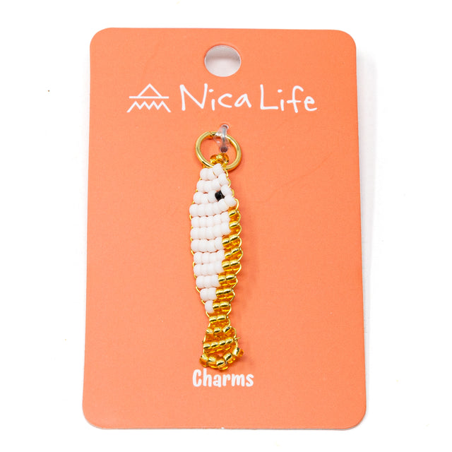 Gold and white beaded charm on a coral card with 'Nica Life' branding