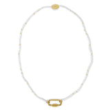 Seed bead charm bar necklace in white and gold shown on white top view