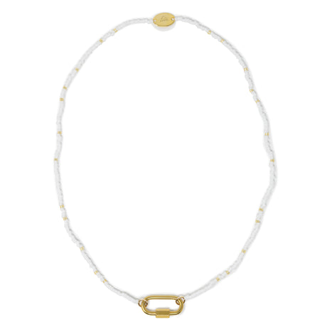 Seed bead charm bar necklace in white and gold shown on white top view