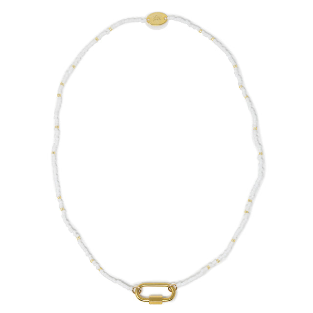 Seed bead charm bar necklace in white and gold shown on white top view