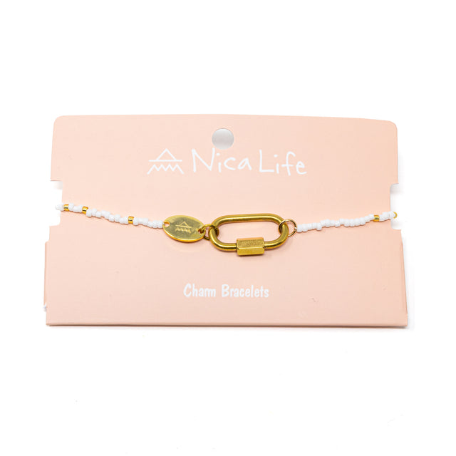 White & gold bead bracelet with lock charm on a pink 'NicaLife' branded card