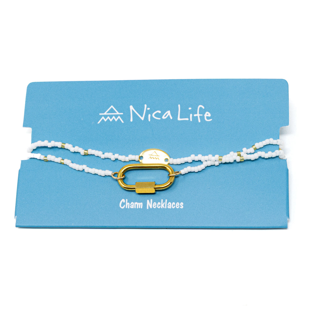 White and gold seed bead charm bar base on blue Nica Life card