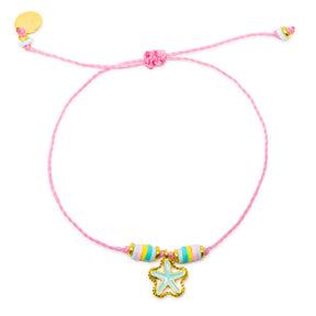 Pink string bracelet with a sea foam green starfish charm and colorful beads shown on white