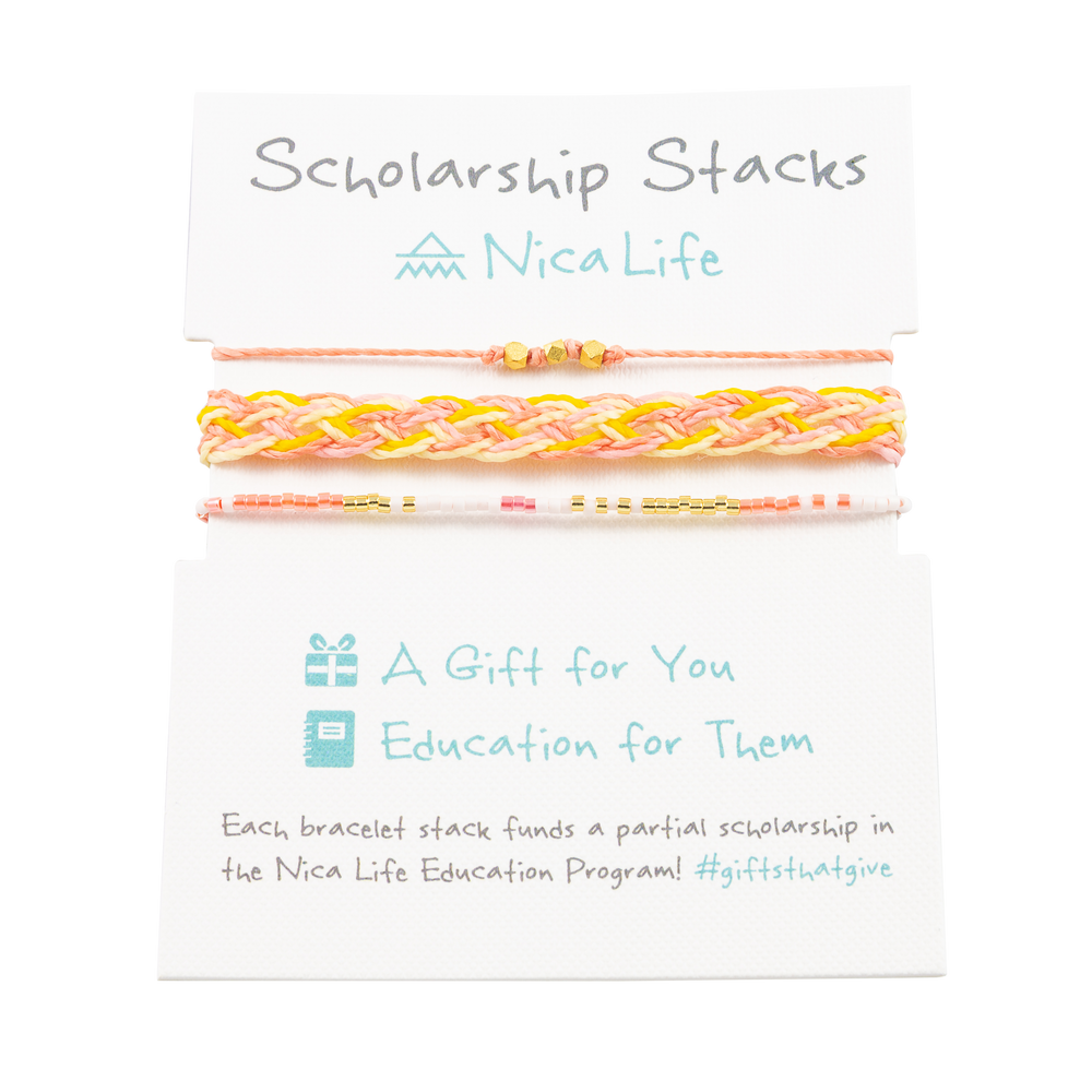 Three pink, yellow, coral and gold bracelets shown on a Nica Life branded product card