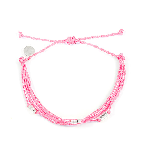 Pink bracelet with silver beaded shown on white