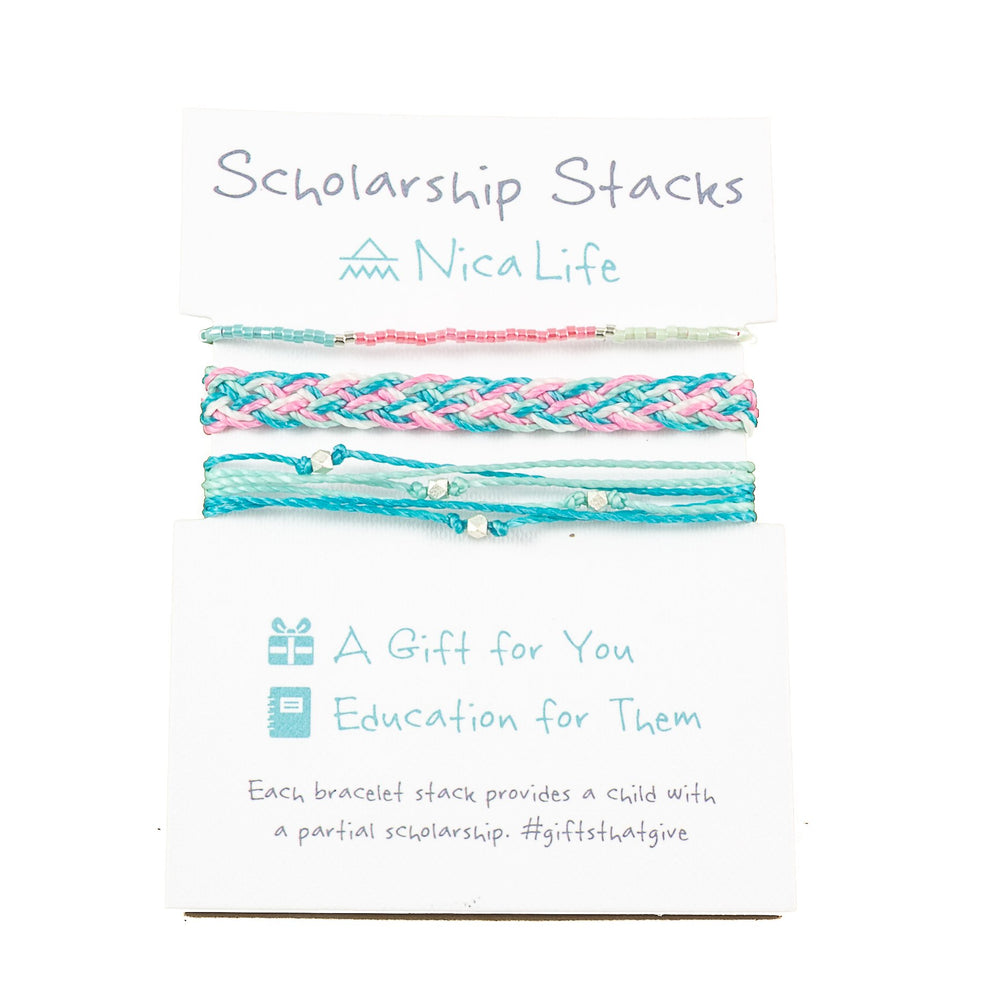 Three pink and teal bracelets shown on a Nica Life branded card