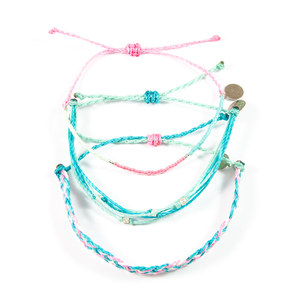 Three coordinating pink & teal bracelets shown on white from the top down